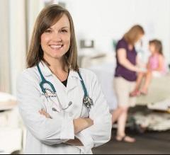 Nurse practitioner standing in front of patient.
